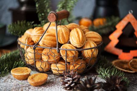 Christmas sweets cookies nuts with condensed milk on the festive table, Christmas decorations,...