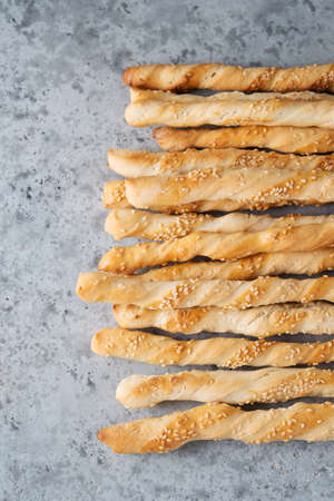 Italian grissini breadsticks with herbs and sesame seeds, top viewの写真素材