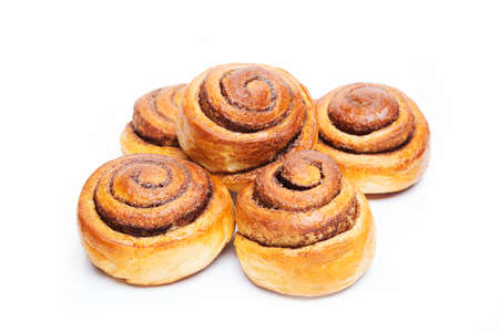 Homemade cinnamon bun isolated on a white background, close-upの写真素材