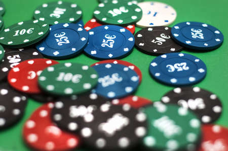gaming pieces scattered on the green table