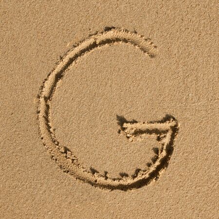 English alphabet in the sandの写真素材