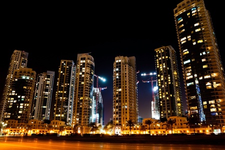 Colorful night view of city of Dubai with modern downtown buildingsの写真素材