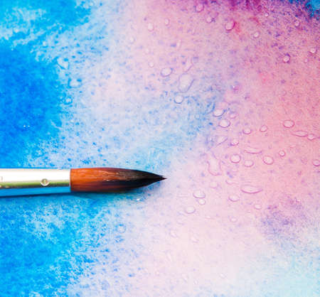 Brush on a colorful backgroundの写真素材