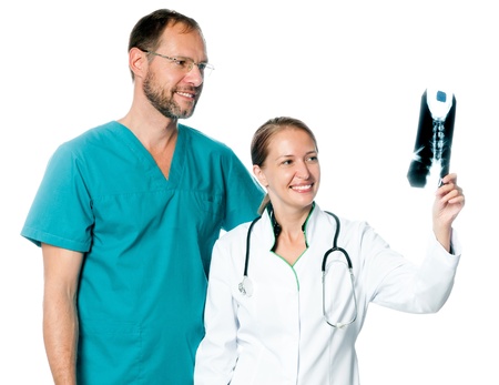 Doctors analyzing an x-ray isolated on a white bckgroundの写真素材