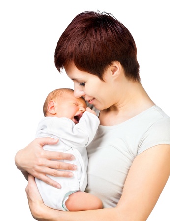 Beautiful mother with baby isolated on whiteの写真素材
