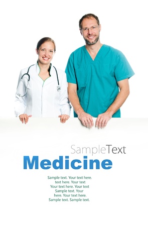 friendly doctors holding a white blank board with sample textの写真素材