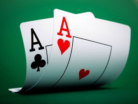 playing cards on a green table casino