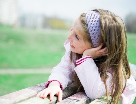 pretty smilling liitle girl in parkの写真素材