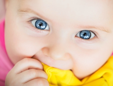 bright closeup portrait of funny adorable babyの写真素材