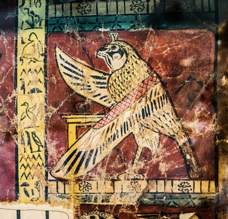 Ancient Egyptian painting with bird and hieroglyphs