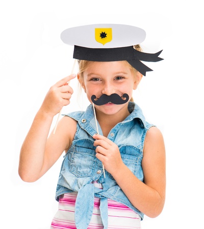 cute little girl in sailor hat with mustacheの写真素材