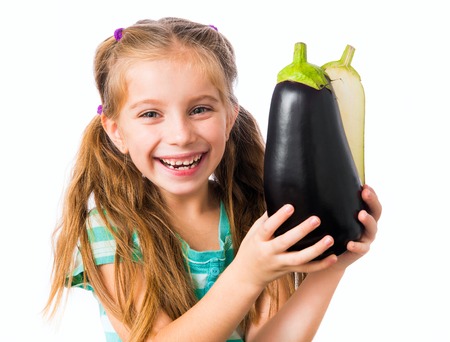 little girl with eggplant halvesの写真素材