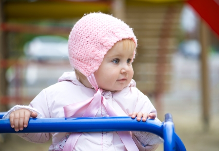 little baby in a swing at the parkの写真素材