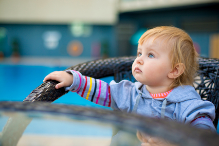 little baby near the poolの写真素材