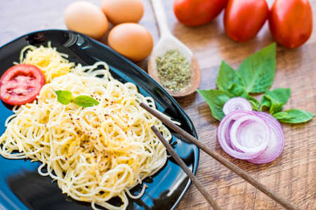 spaghetti dinner with sauce and vegetables close upの写真素材