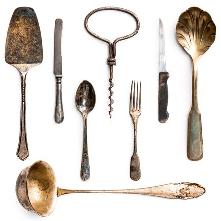 old metal utensils on a white backgroundの写真素材