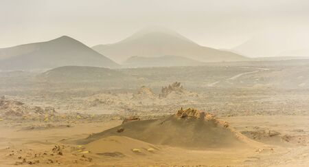 beautiful mountain landscape with volcanoes in Timanfaya National Park in Lanzarote, Canary Islandsの写真素材