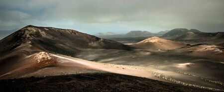 beautiful mountain landscape with volcanoes in Timanfaya National Park in Lanzarote, Canary Islandsの写真素材