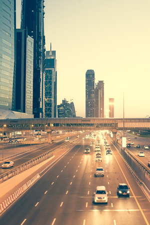 Skyscraper roads and bridge at the Sheikh Zayed Road in Dubai in the evening, United Arab Emiratesの写真素材