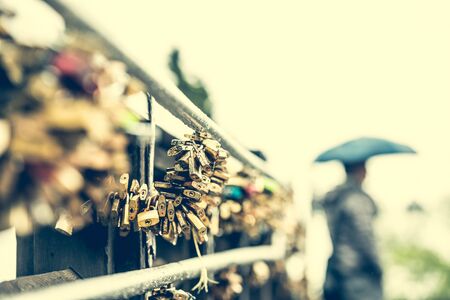 hundreds locks on lover bridge as a traditional symbol of eternal feelingの写真素材