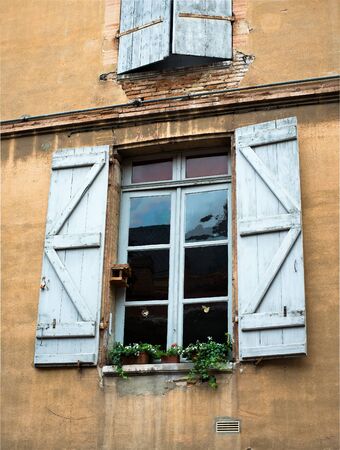 old vintage window in a brick wallの写真素材