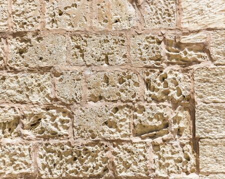 old weathered rough stone wall texture