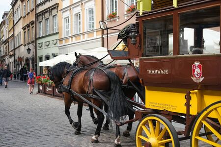 Warsaw, Poland - june 20, 2015: passing by carriage on Warsaw street in Polandのeditorial素材