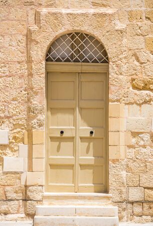 traditional arch door in Maltese Mdinaの写真素材