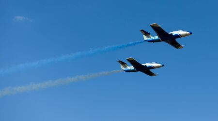 Kharkiv, Ukraine - August 24, 2015: planes performing colorful trails at Kharkiv airshowのeditorial素材