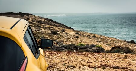 car on sea coast backgroundの写真素材