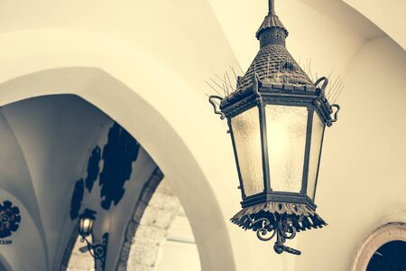 old ceiling lantern in old building with archesの写真素材