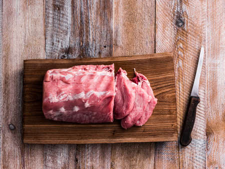 big piece of raw meat on cutting boardの写真素材