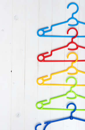 set of colorful plastic clothes hangers with text spaceの写真素材