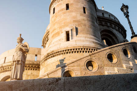 view on tower and walls of Fishermen Bastion with a statue of a fisherman in Budapestの写真素材