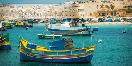 postcard with fishing boats near fishing village of Marsaxlokk (Marsascala) in Maltaの写真素材