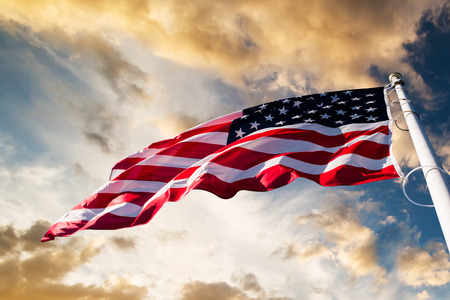 american flag waving  blue sky