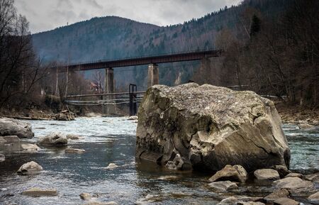 landscape in Carpathian mountains with river, railway bridgeの写真素材