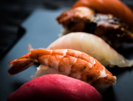 close up of sashimi sushi set on black trayの写真素材