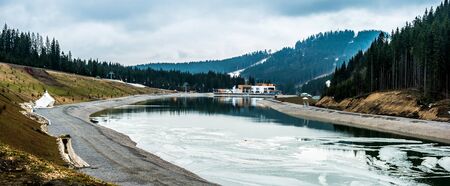 panorama of beautiful mountain lake with view on mountains in Carpathians, Ukraineの写真素材