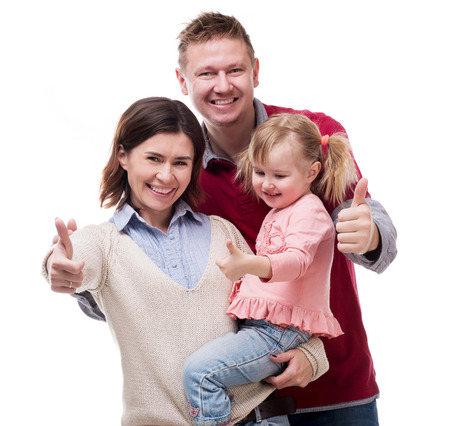 parents with little daughter portrait with thumbs up isolated on white backgroundの写真素材