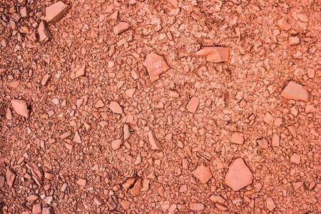 texture with red iron mineral ground with stones
