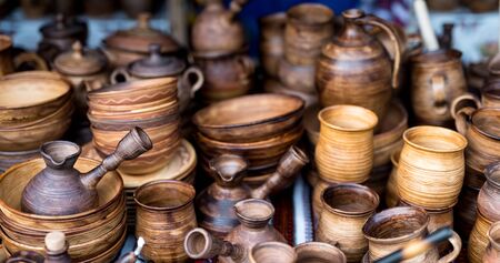 variety of wooden utensil at market on stallの写真素材