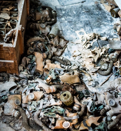 abandoned school room with trash and masks on the floor in Pripyat, Chernobyl, Ukraineの写真素材