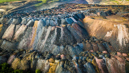 landscape with multicolored rock dumps from quarries, aerial photo