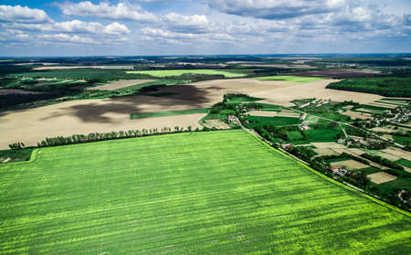 beautiful green field with village, view from heightの写真素材