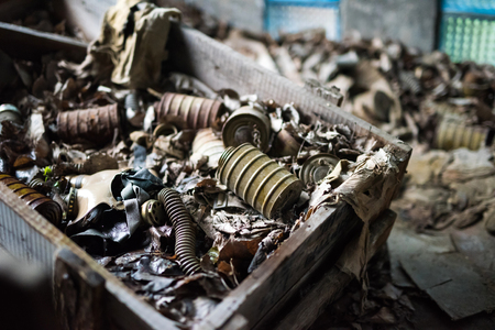 abandoned school room with masks in box on the floor in Pripyat, Chernobyl, Ukraineの写真素材