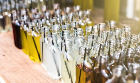 homemade refreshing drinks in bottles on counter on street food festivalの写真素材