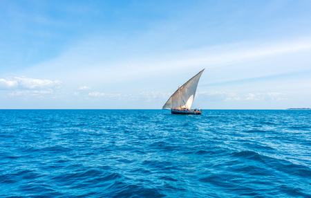 beautiful colorful seascape with african sail boat on the horizon