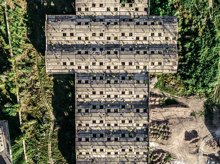 large obsolete building roof with windows, earial photo, top viewの写真素材