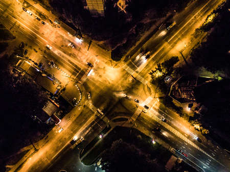 night illuminated city crossroad, top view, aerial photoの写真素材